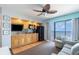 Cozy kitchenette with wood cabinets, black appliances and ocean view at 4800 S Ocean Blvd. # 1007, North Myrtle Beach, SC 29582
