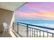 Balcony view of the beach and ocean with sunset colors at 4800 S Ocean Blvd. # 1007, North Myrtle Beach, SC 29582