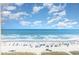 Expansive view of ocean, beach, and umbrellas under blue sky at 4800 S Ocean Blvd. # 1007, North Myrtle Beach, SC 29582