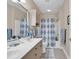 Bathroom boasts double sinks, shower/tub combo, and updated vanity at 4882 Luster Leaf Circle # 202, Myrtle Beach, SC 29577