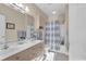 Well-appointed bathroom with double vanity and shower/tub combo at 4882 Luster Leaf Circle # 202, Myrtle Beach, SC 29577