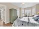 Bright bedroom with a king-size bed and built-in shelving at 4882 Luster Leaf Circle # 202, Myrtle Beach, SC 29577