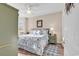 Spacious bedroom with king bed, wooden furniture, and natural light at 4882 Luster Leaf Circle # 202, Myrtle Beach, SC 29577