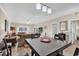 Bright dining area with a table and chairs, open to the living room at 4882 Luster Leaf Circle # 202, Myrtle Beach, SC 29577