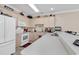 Bright kitchen with white appliances and light cabinets at 4882 Luster Leaf Circle # 202, Myrtle Beach, SC 29577