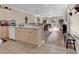 Kitchen with light cabinets, and view into living room at 4882 Luster Leaf Circle # 202, Myrtle Beach, SC 29577