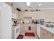 Bright kitchen with white appliances and light cabinets at 4882 Luster Leaf Circle # 202, Myrtle Beach, SC 29577