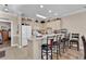 Kitchen with breakfast bar and view into dining area at 4882 Luster Leaf Circle # 202, Myrtle Beach, SC 29577