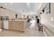 Kitchen with light cabinets, and view into living room at 4882 Luster Leaf Circle # 202, Myrtle Beach, SC 29577