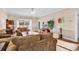 Comfortable living room featuring hardwood floors and ample natural light at 4882 Luster Leaf Circle # 202, Myrtle Beach, SC 29577