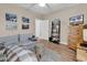 Living room with sectional sofa, wooden furniture, and large TV at 4882 Luster Leaf Circle # 202, Myrtle Beach, SC 29577