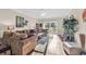 Bright living room with hardwood floors, comfy sofas, and access to a balcony at 4882 Luster Leaf Circle # 202, Myrtle Beach, SC 29577