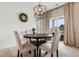 Dining area with a round table and four chairs, and sliding door access to backyard at 556 Affinity Dr., Myrtle Beach, SC 29588