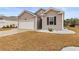 One story house with white garage door and landscaping at 556 Affinity Dr., Myrtle Beach, SC 29588