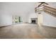 Living room featuring a fireplace, high ceilings, and access to the backyard at 560 Aspen Loop, Pawleys Island, SC 29585