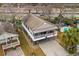 Elevated view of beach house with spacious deck and parking area at 6001 - 7032 S Kings Hwy., Myrtle Beach, SC 29575