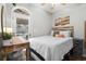 Bedroom with a cozy bed and access to porch at 6001 - 7032 S Kings Hwy., Myrtle Beach, SC 29575