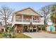 Two-story beach home with a wrap-around porch and large deck at 6001 - 7032 S Kings Hwy., Myrtle Beach, SC 29575