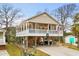 Elevated beach home with large deck and parking underneath at 6001 - 7032 S Kings Hwy., Myrtle Beach, SC 29575