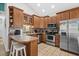 L-shaped kitchen with wood cabinets and stainless steel appliances at 6001 - 7032 S Kings Hwy., Myrtle Beach, SC 29575