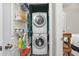 Stackable washer and dryer in convenient laundry room with storage shelves at 6001 - 7032 S Kings Hwy., Myrtle Beach, SC 29575