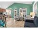 Bright living area with comfy seating and access to a screened porch at 6001 - 7032 S Kings Hwy., Myrtle Beach, SC 29575