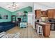 Open living space with kitchen, teal walls, and comfy seating at 6001 - 7032 S Kings Hwy., Myrtle Beach, SC 29575