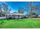 House exterior with gray siding and metal roof at 619 5Th Ave. N, Surfside Beach, SC 29575