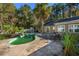 Inviting kidney-shaped pool with patio and palm tree at 6252 Salem Rd., Myrtle Beach, SC 29588