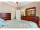 Spacious bedroom with wood furniture and en-suite bathroom access at 645 Lafayette Park Dr., Little River, SC 29566