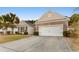 Brick front house with two-car garage and landscaped lawn at 645 Lafayette Park Dr., Little River, SC 29566