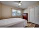 Well-lit bedroom with a ceiling fan and double doors at 829 9Th Ave. S, North Myrtle Beach, SC 29582