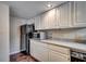 Modern kitchen with stainless steel appliances and white cabinets at 829 9Th Ave. S, North Myrtle Beach, SC 29582