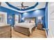 Bright bedroom with a king-size bed and blue walls at 834 Sail Ln. # 202, Murrells Inlet, SC 29576