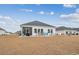 Spacious backyard with patio, screened porch and pond view at 838 Sandy Side Dr., Little River, SC 29566