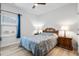 Bright bedroom with a queen bed, nightstands, and ceiling fan at 838 Sandy Side Dr., Little River, SC 29566