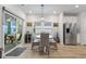 Kitchen dining area with a round table and wicker chairs at 838 Sandy Side Dr., Little River, SC 29566