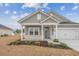 Charming house with gray siding, white trim, and a covered porch at 838 Sandy Side Dr., Little River, SC 29566