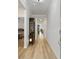 Long hallway with light wood floors and access to other rooms at 838 Sandy Side Dr., Little River, SC 29566