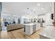 Open concept kitchen features island, stainless steel appliances, and white cabinetry at 838 Sandy Side Dr., Little River, SC 29566