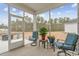 Relaxing screened porch with outdoor seating at 838 Sandy Side Dr., Little River, SC 29566