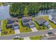 Aerial view of houses near a lake with lush green landscaping at 859 Wild Leaf Loop, Conway, SC 29526