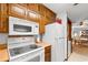 White appliances and wood cabinets in condo kitchen at 9621 Shore Dr. # B-112, Myrtle Beach, SC 29572