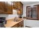 Condo kitchen with wood cabinets, sink, and window at 9621 Shore Dr. # B-112, Myrtle Beach, SC 29572
