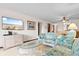 Bright living room features comfy sofas, coffee table, and a large TV at 9621 Shore Dr. # B-112, Myrtle Beach, SC 29572