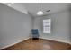 Clean bedroom featuring wood floors, natural light, and simple decor at 9650 Bradford Ln., Murrells Inlet, SC 29576