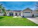 Charming one-story home featuring a well-manicured lawn, neutral siding, and attached garage at 9650 Bradford Ln., Murrells Inlet, SC 29576