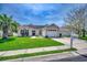 Charming single-story home boasts a manicured lawn and a cozy front porch with seating at 9650 Bradford Ln., Murrells Inlet, SC 29576