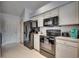 Kitchen boasts stainless steel appliances and white cabinets at 9650 Bradford Ln., Murrells Inlet, SC 29576