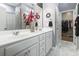 Double vanity bathroom with marble floors and a walk-in closet at 100 Machrie Loop # 17-C, Myrtle Beach, SC 29588